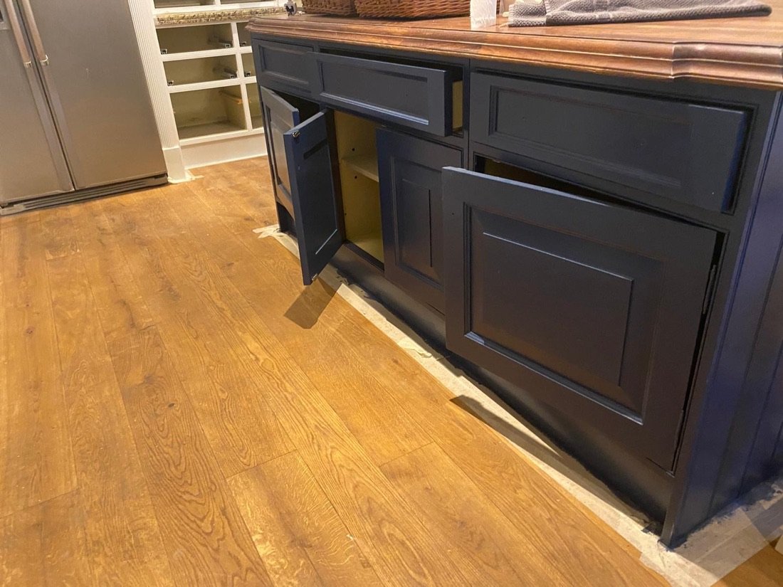 Hand-painted navy cabinetry, sprayed and brushed finish
